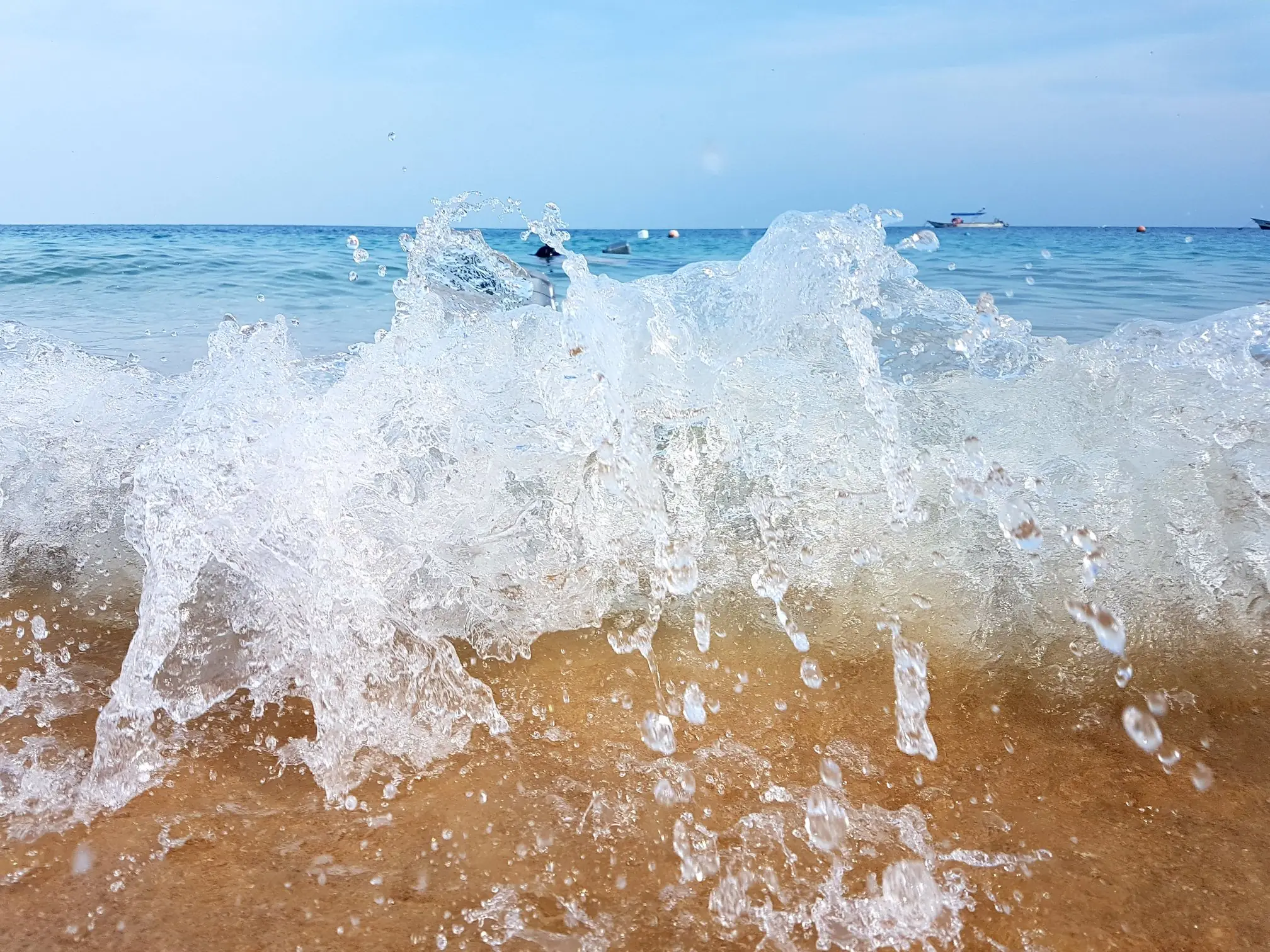 Mesmerizing Close-Up of Waves Crashing on Tioman Island’s Beach